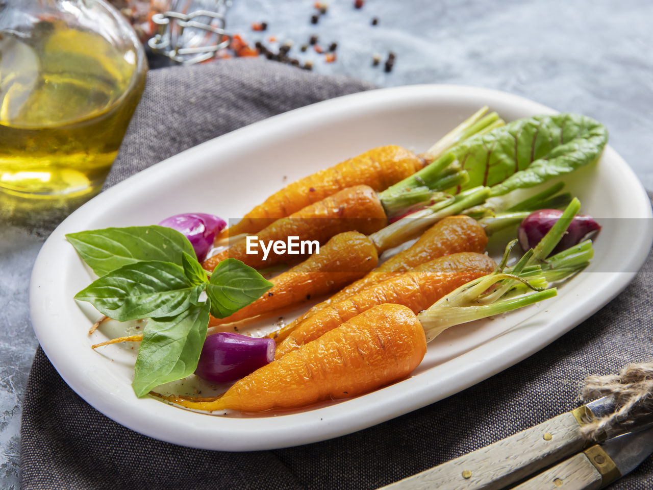 CLOSE-UP OF SALAD SERVED IN PLATE ON TABLE