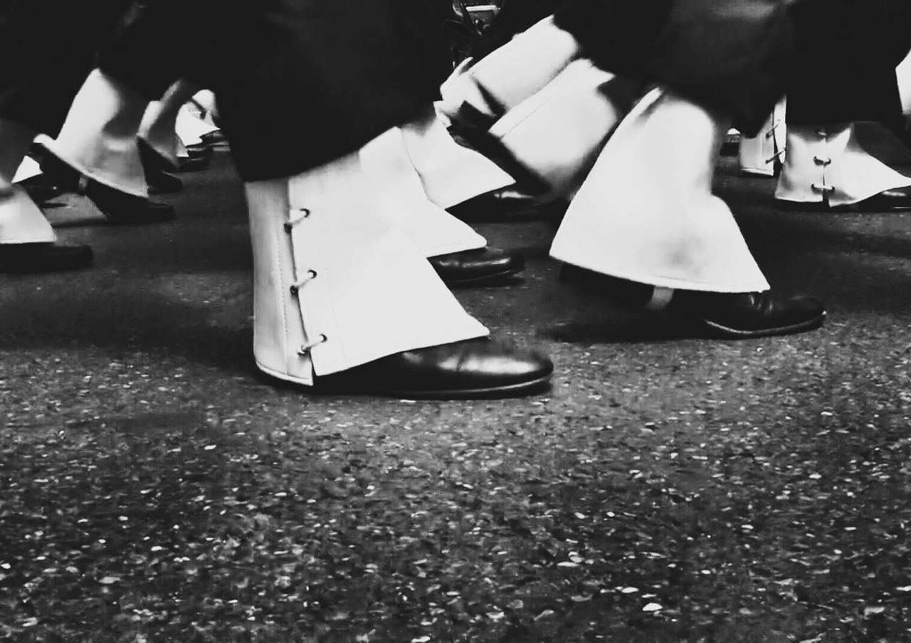 Human feet walking in street