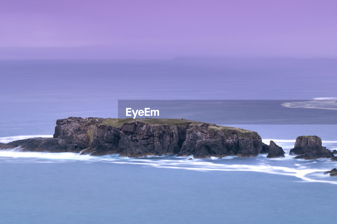 Cliffs of seixo branco galicia. purple sky, seagull nests in summer