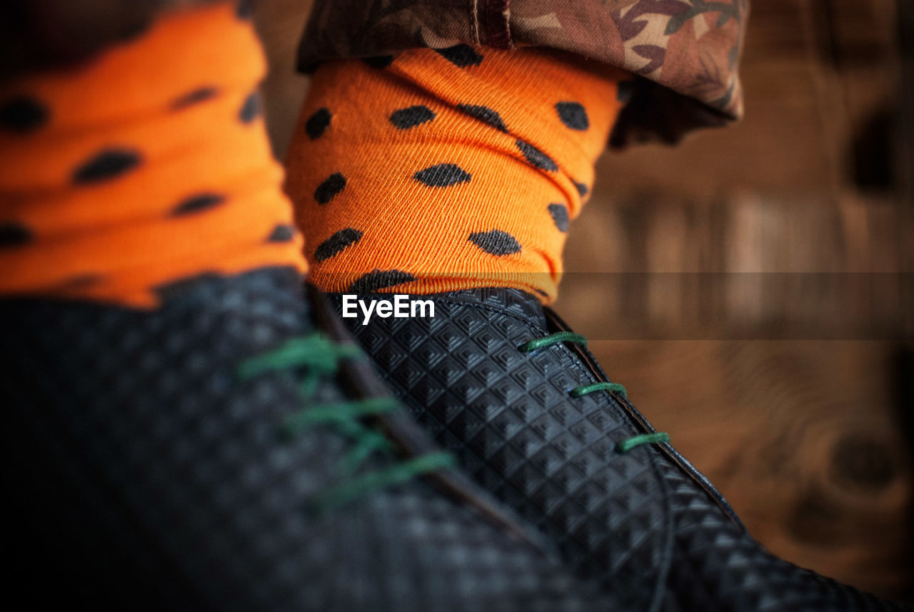 Close up of man wearing colorful socks