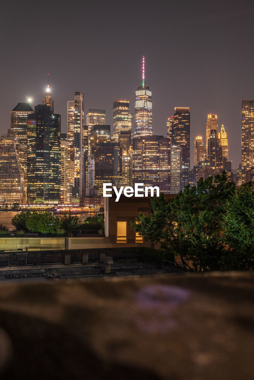 Illuminated buildings in city at night