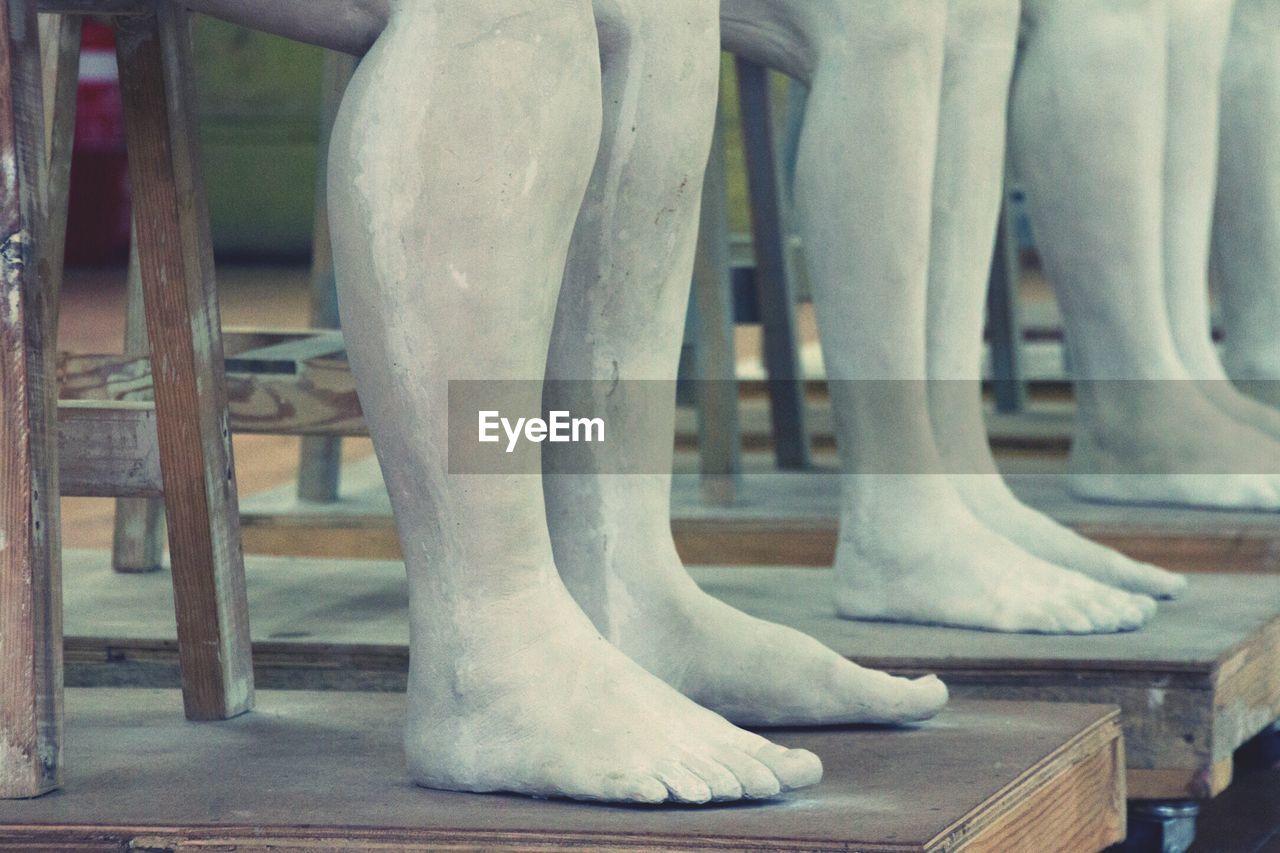 Close-up of feet sculptures 