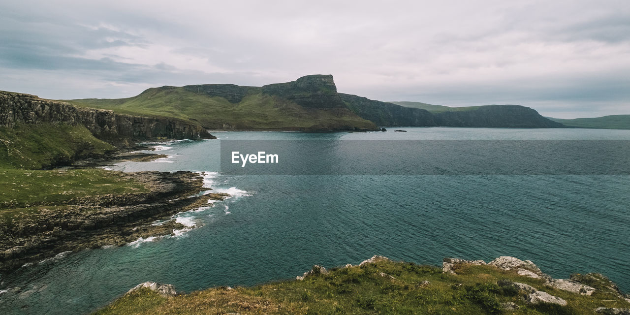 Scenic view of neist point against cloudy sky