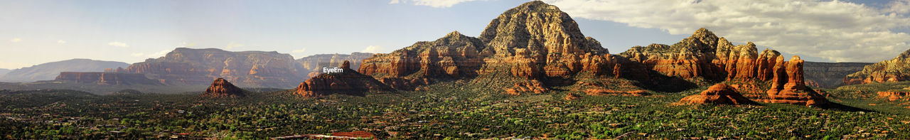 Panoramic view of rocks and mountains against sky