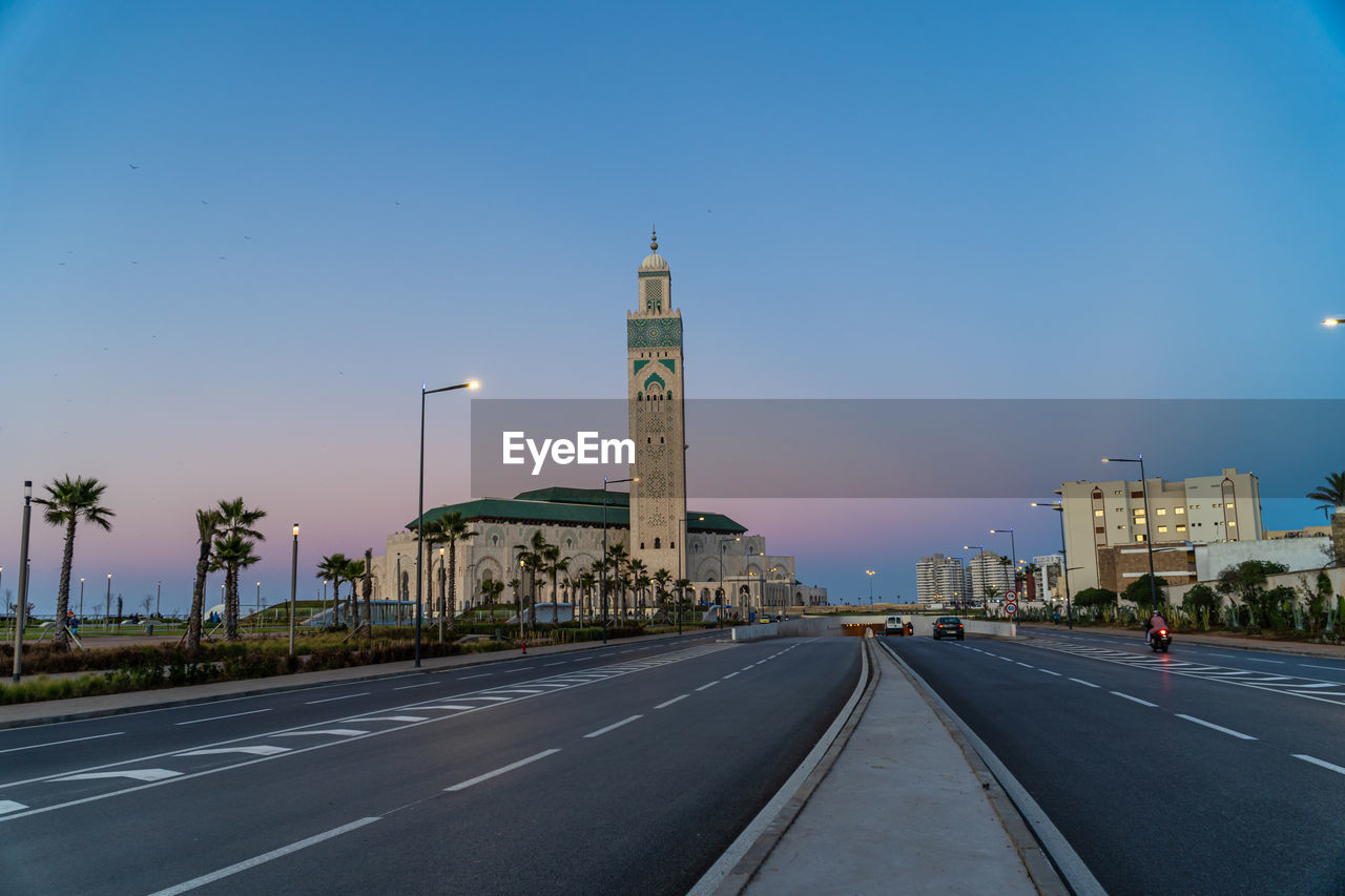 View of hassan ii mosque seen from road at sunset - casablanca, morocco