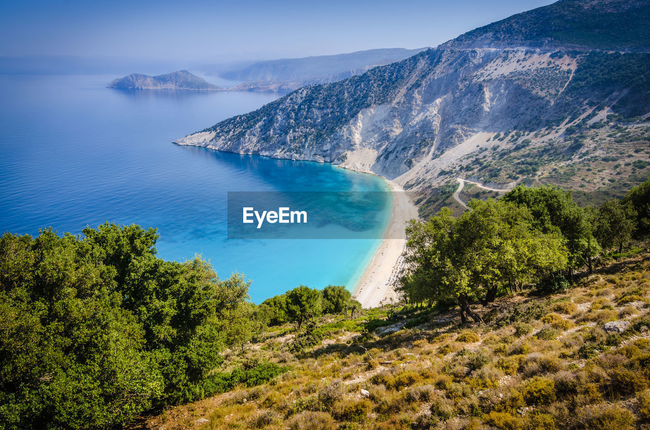 HIGH ANGLE VIEW OF SEA AND MOUNTAIN