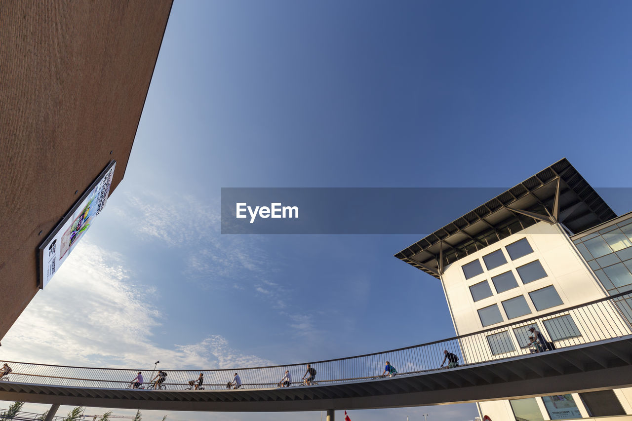 LOW ANGLE VIEW OF BRIDGE AND BUILDINGS AGAINST SKY