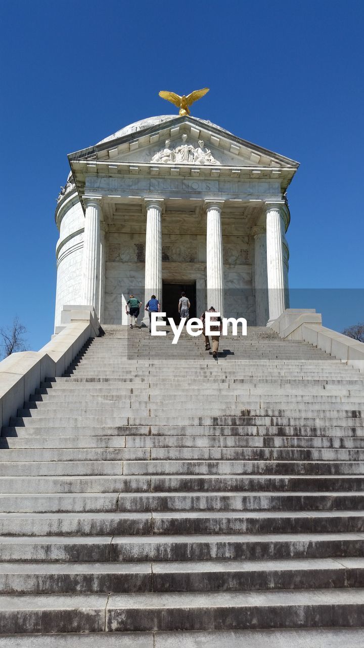 Low angle view of people moving up on steps at vicksburg national military park