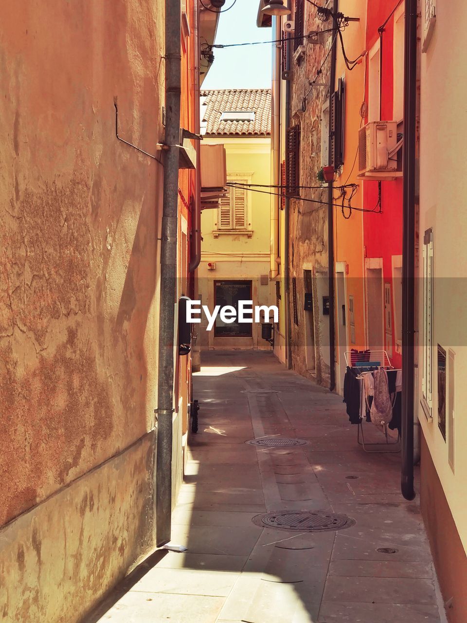 NARROW STREET AMIDST BUILDINGS