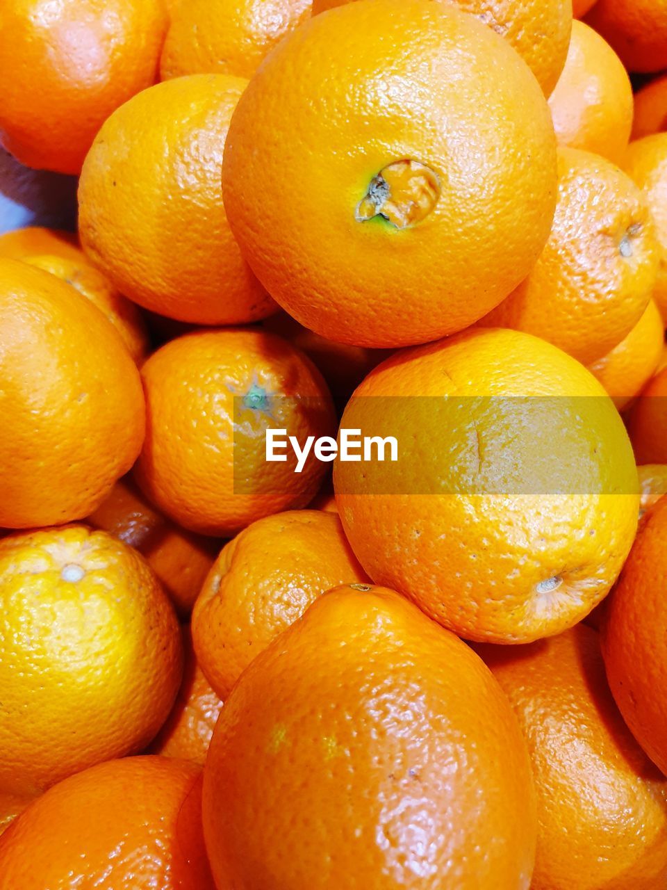 Close-up of oranges for sale at market stall