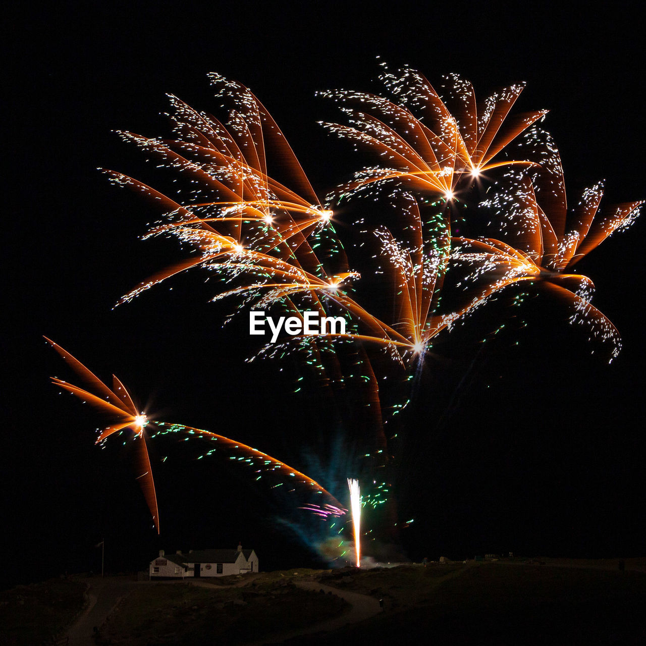 night, illuminated, fireworks, motion, celebration, event, arts culture and entertainment, firework display, exploding, glowing, long exposure, no people, nature, firework - man made object, sky, outdoors, blurred motion, recreation, multi colored, light, new year's eve