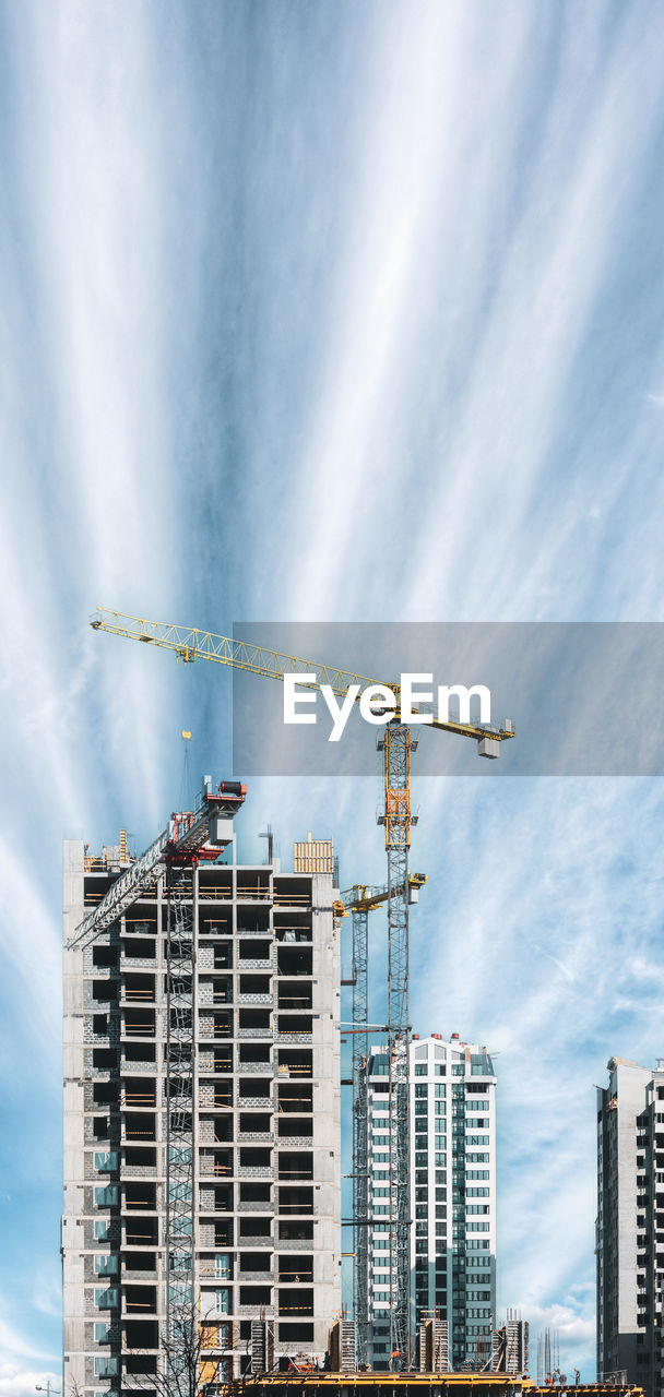 low angle view of modern buildings against sky