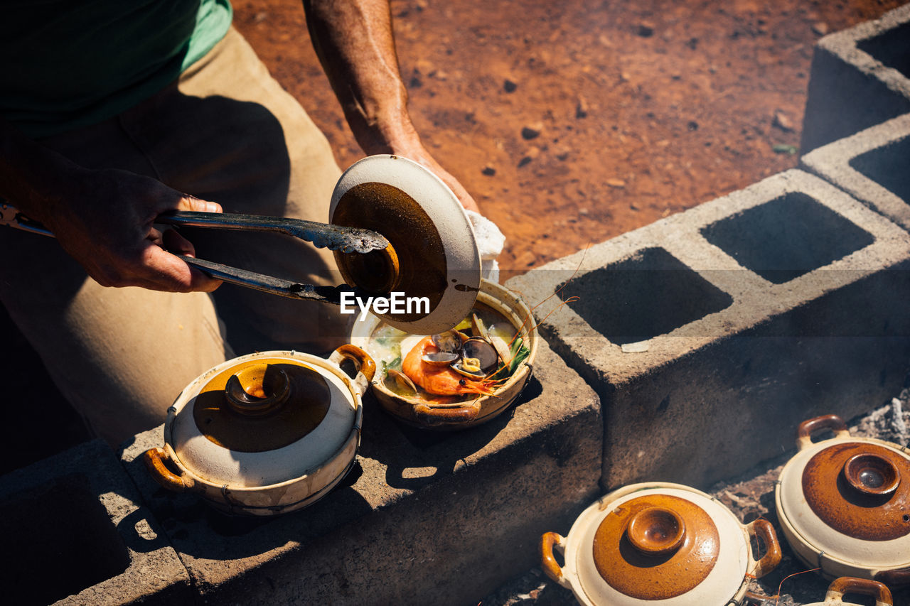 Midsection of man preparing food