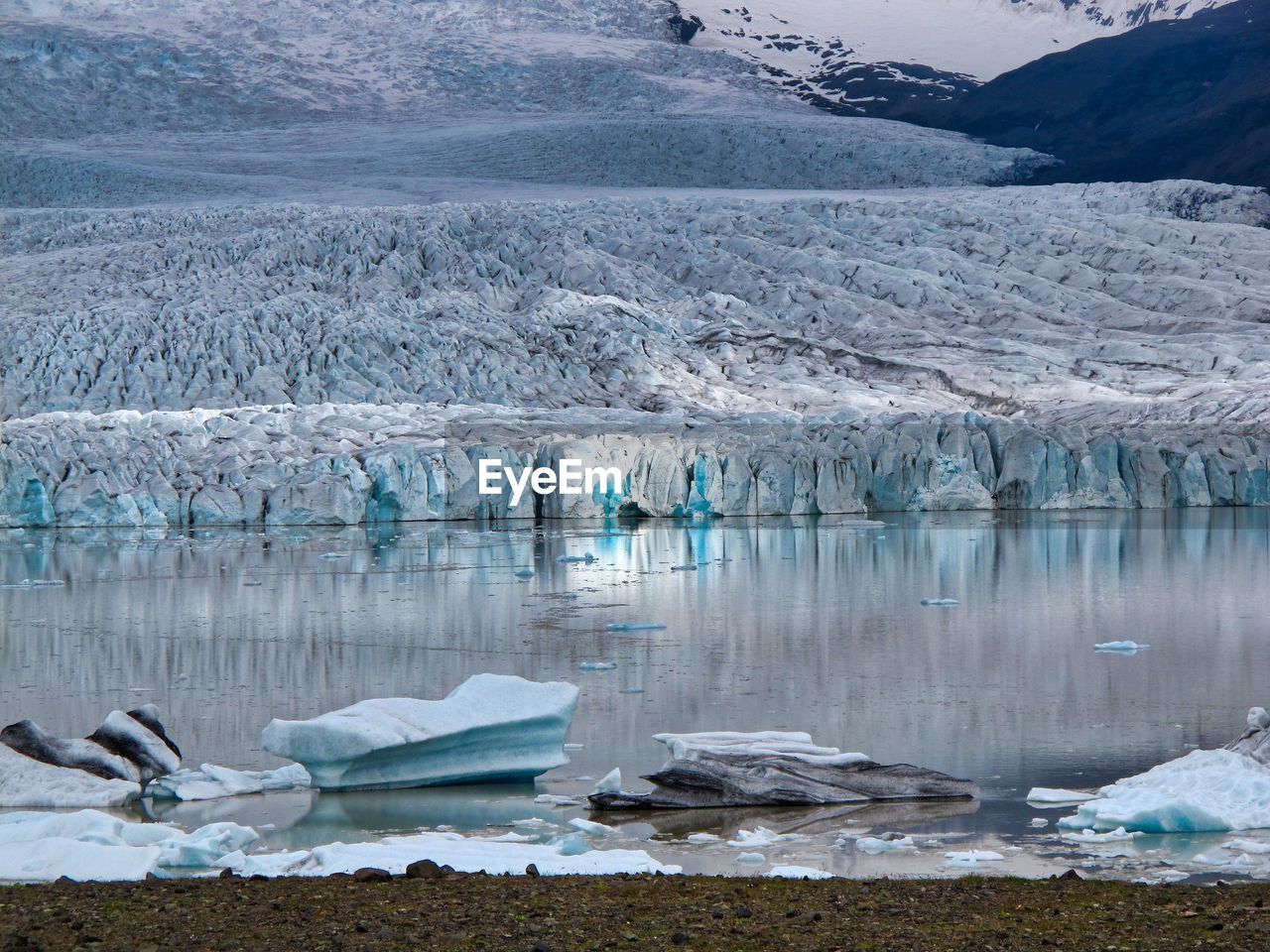 Scenic view of icebergs in lake during winter