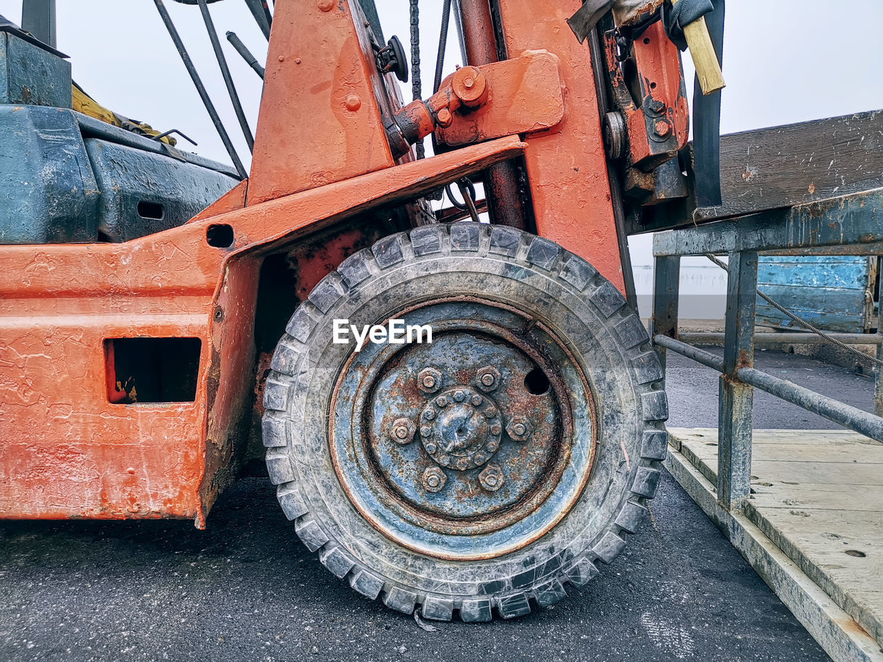 Close-up front wheel of old forklift truck