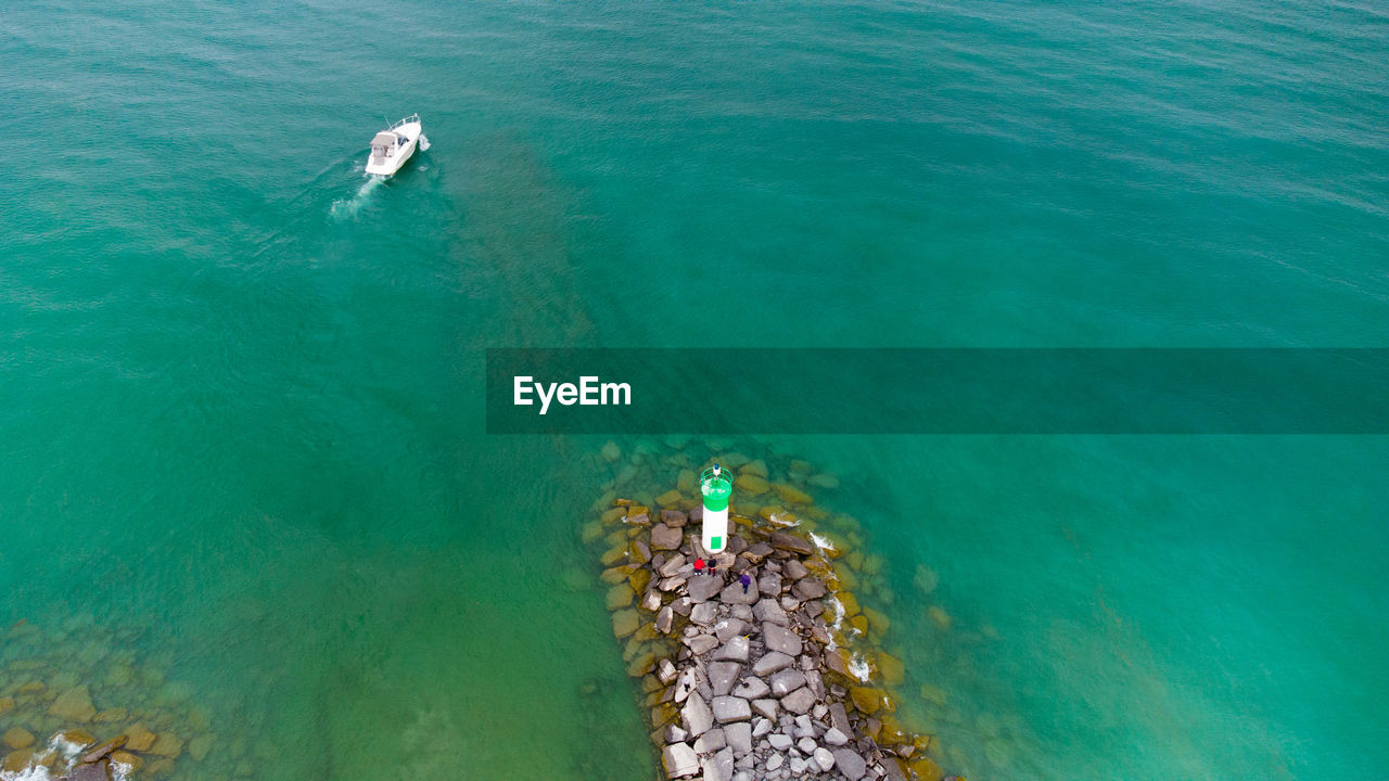 High angle view of people swimming in sea