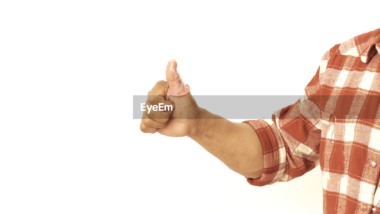 LOW ANGLE VIEW OF MAN HAND ON WHITE BACKGROUND