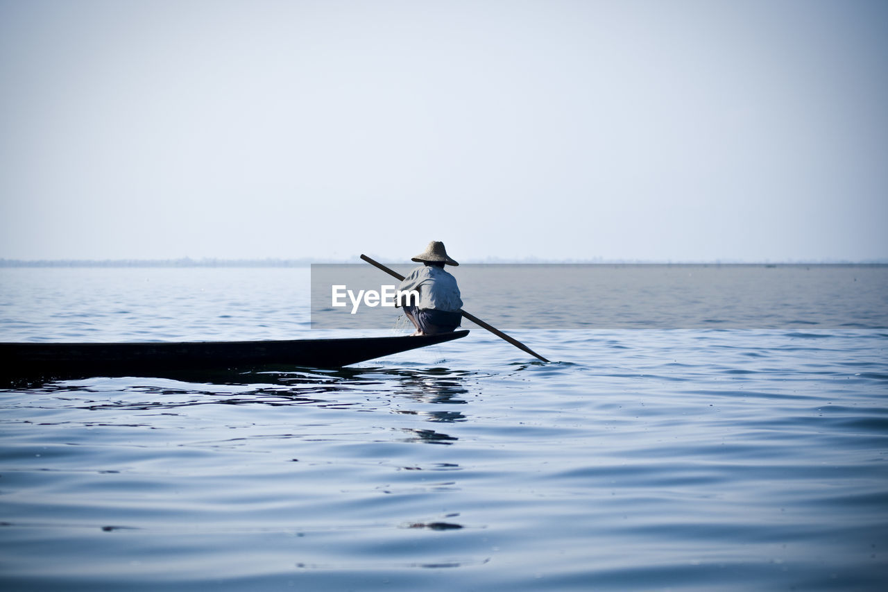 Man rowing on boat