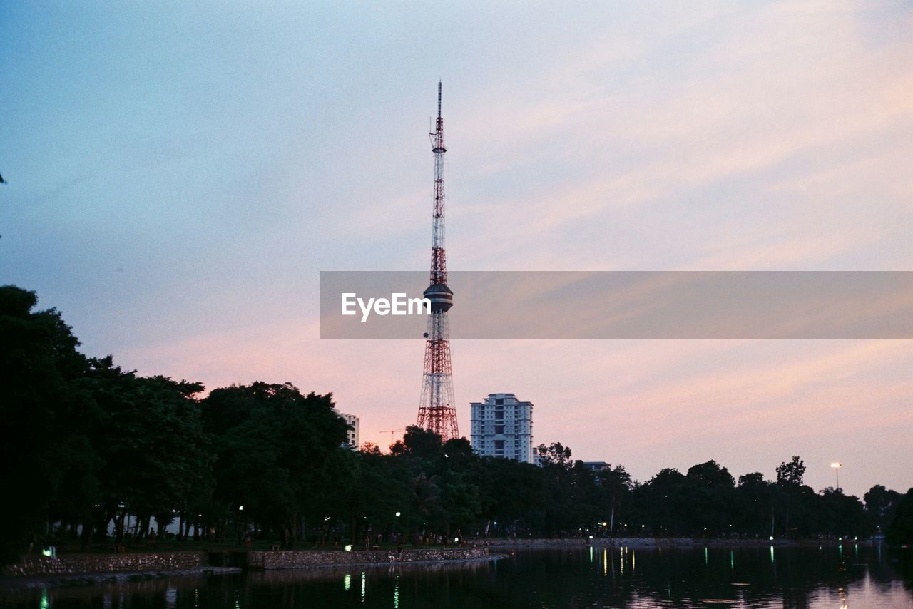 COMMUNICATIONS TOWER AND BUILDINGS AGAINST SKY