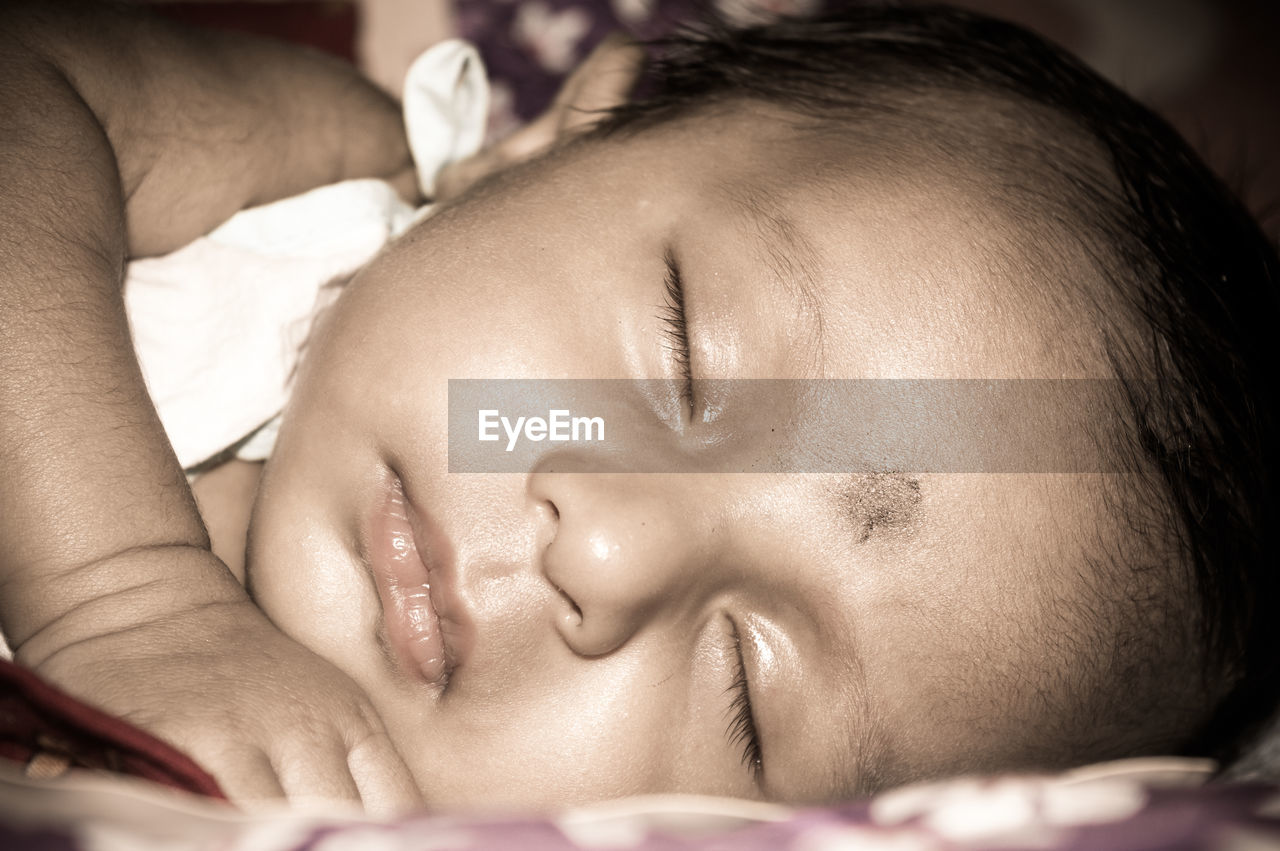 CLOSE-UP PORTRAIT OF A BABY SLEEPING