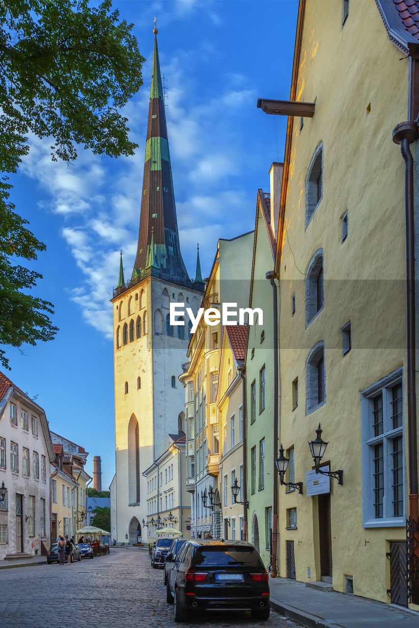 Street in tallinn old town with olaf church, estonia