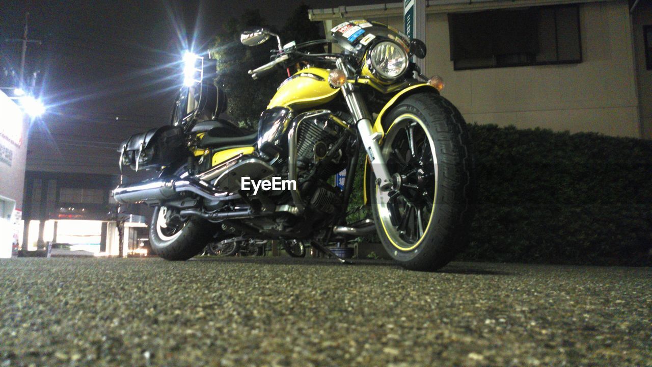 MOTORCYCLE IN ILLUMINATED AT NIGHT