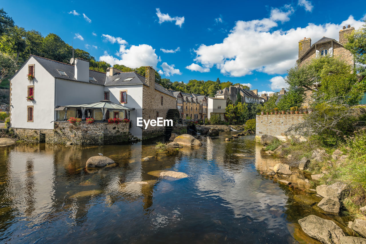 Scenic view of pont-aven vilage in brittany france against dramatic summer sky