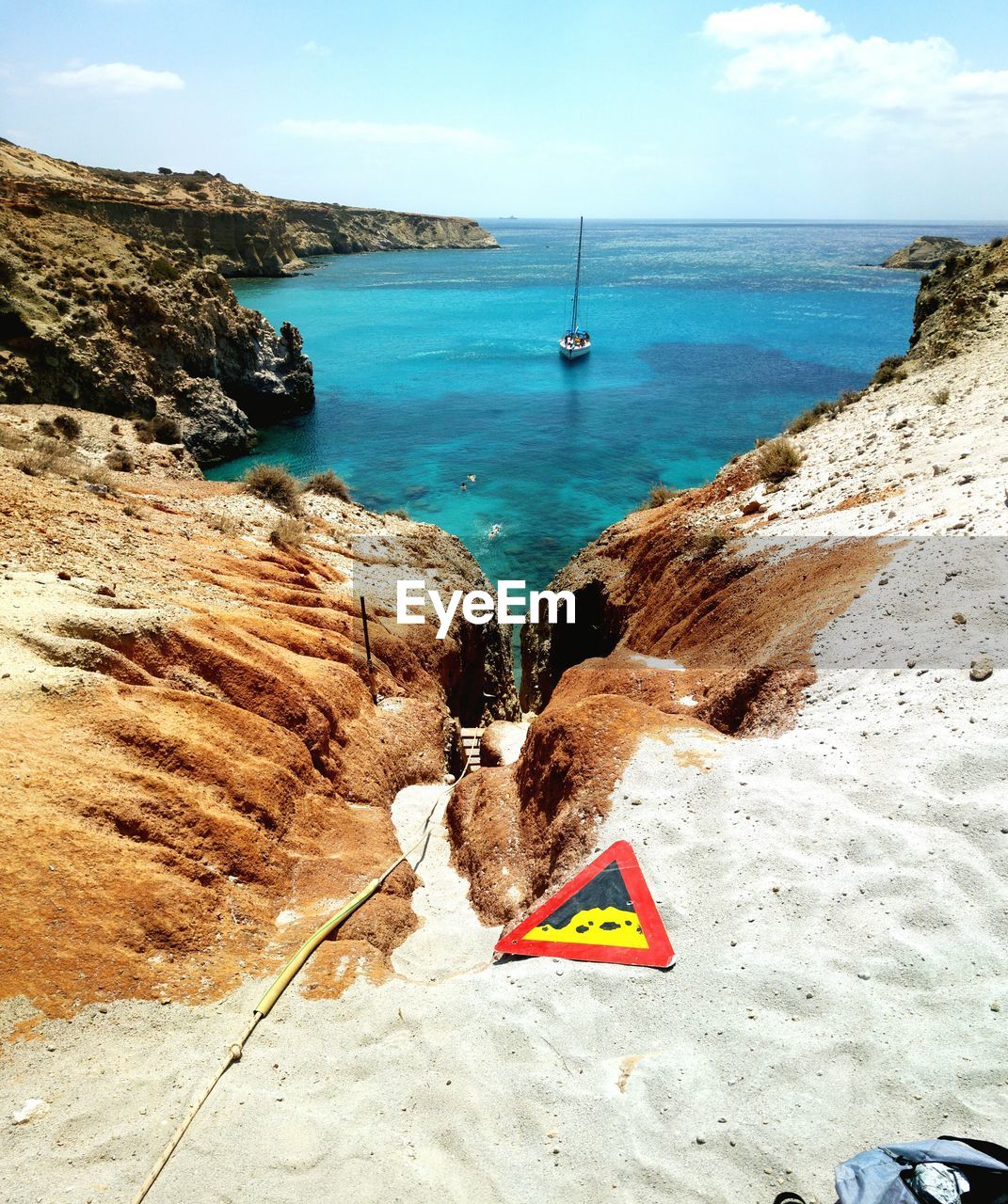 Scenic view of sea and boat from sand dune