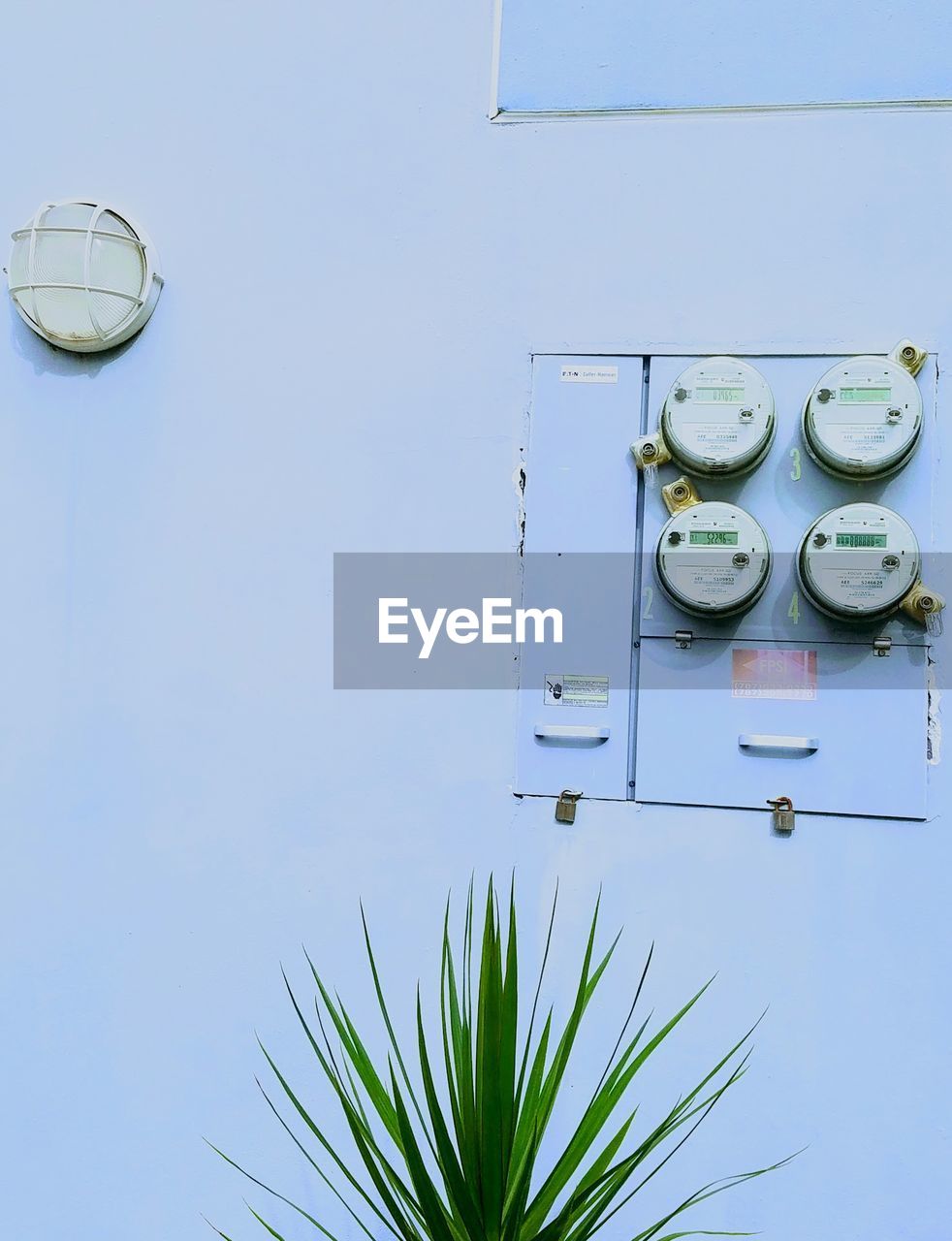 Shot of electric meters in a blue background 