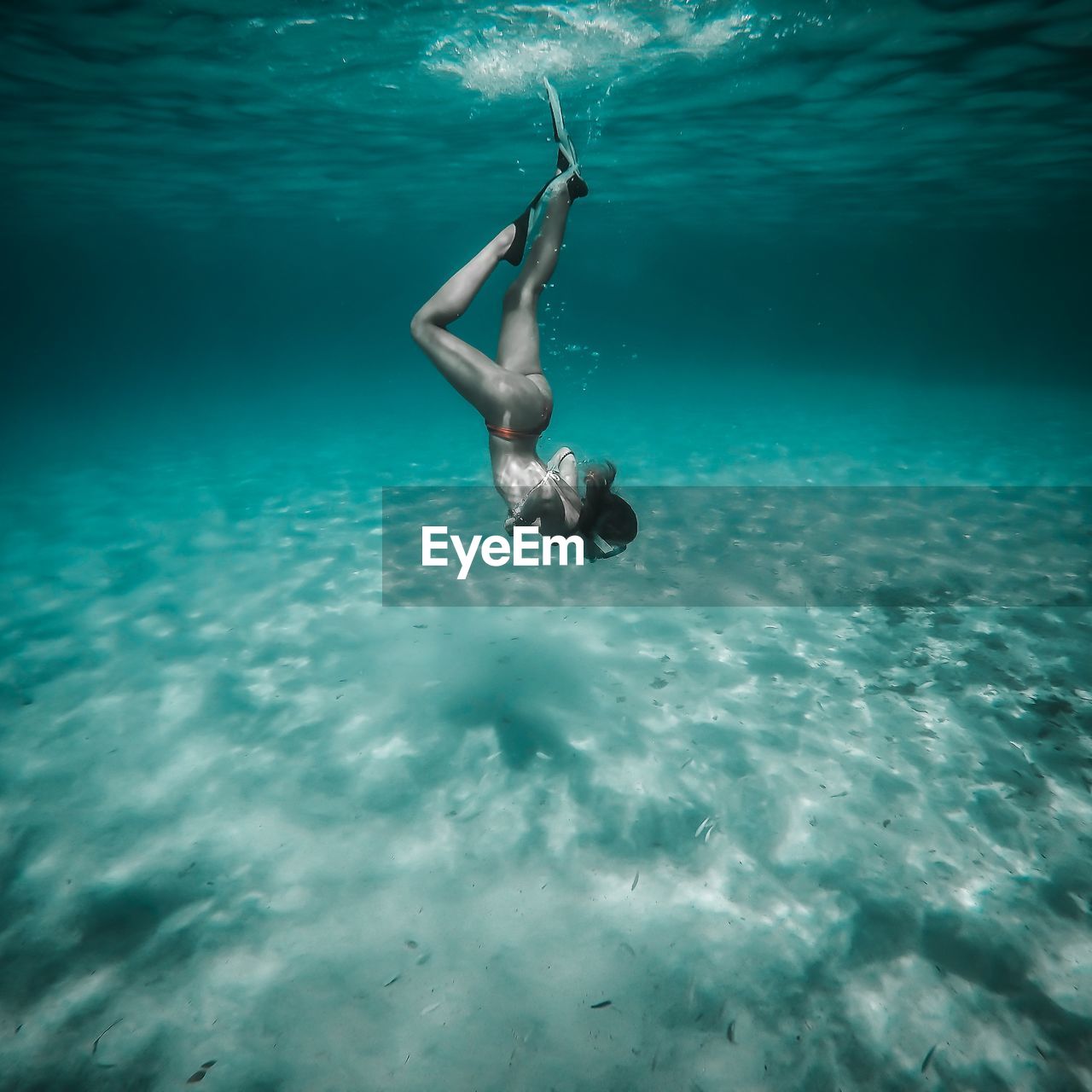 Young woman swimming in sea