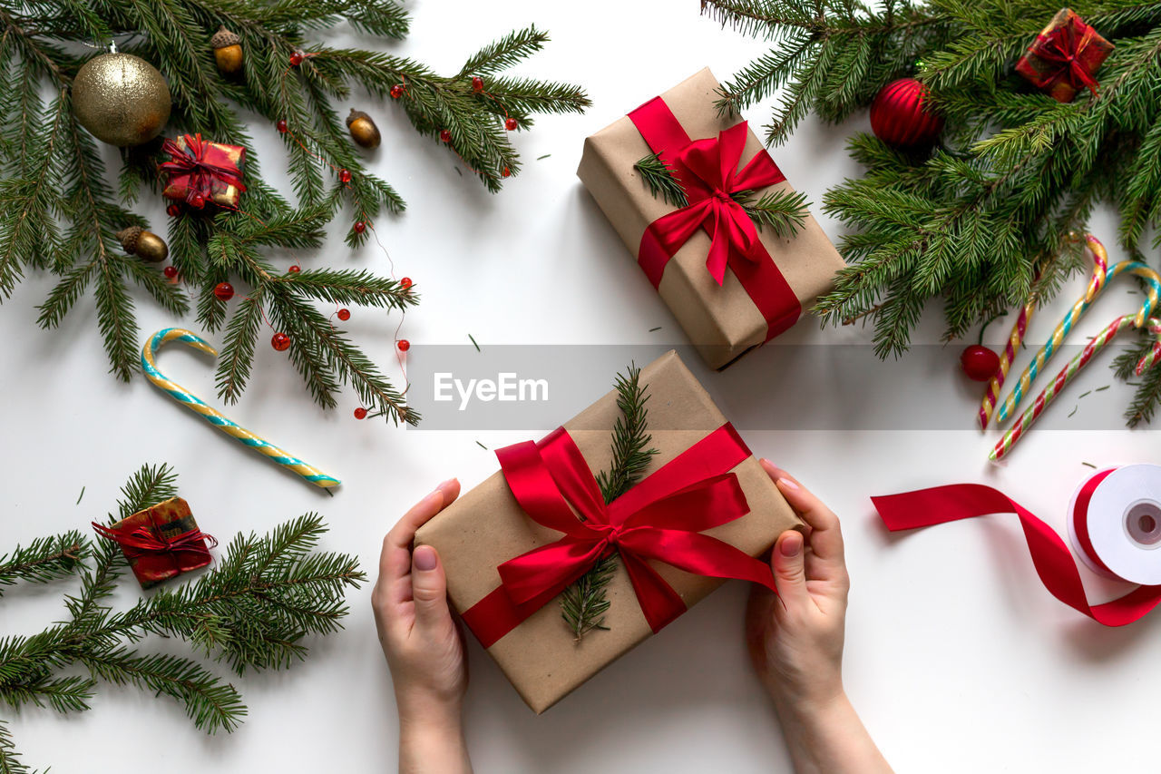 Christmas gifts in craft paper and tied with a red ribbon. christmas decorations