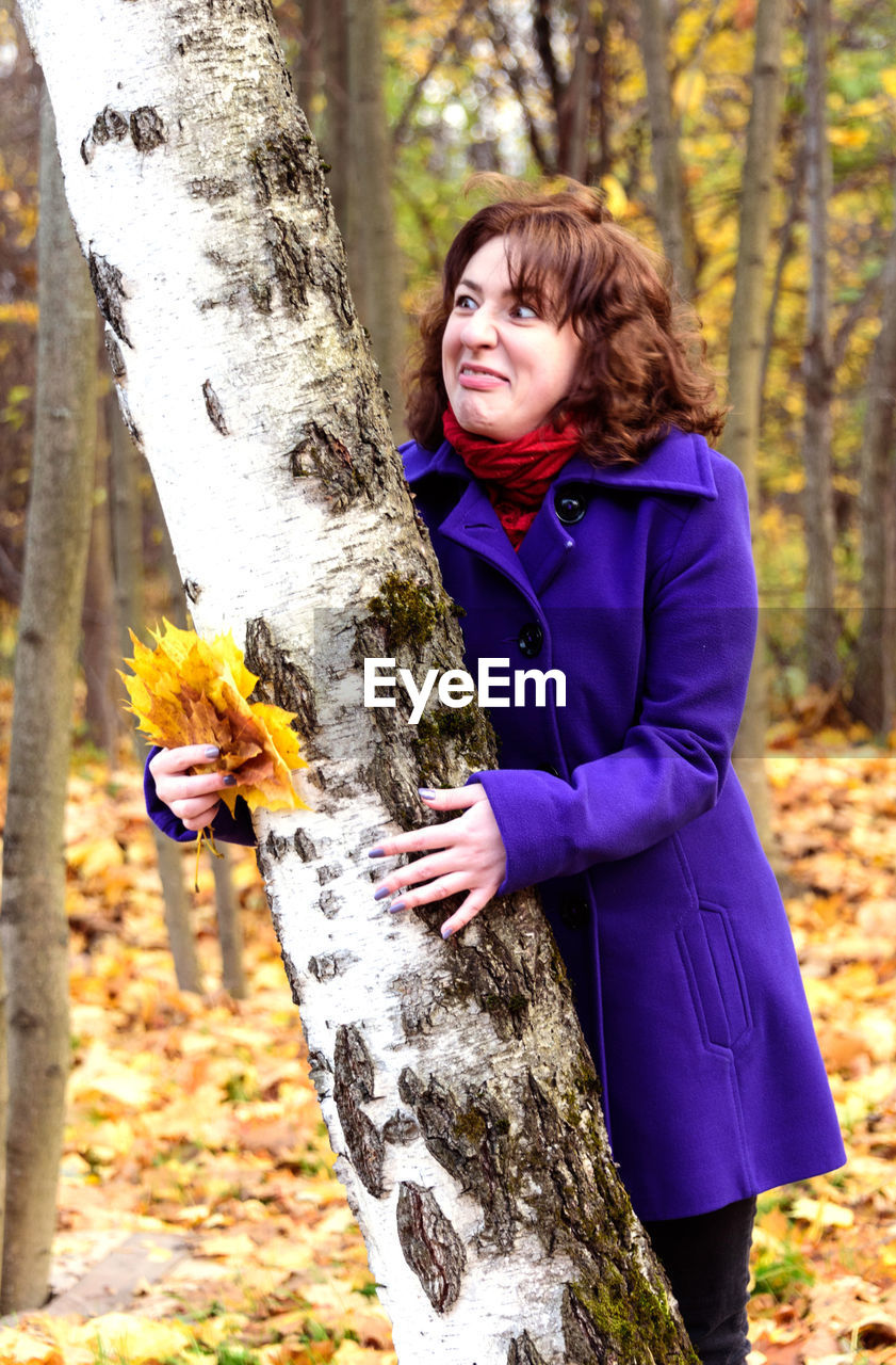 The girl saw something unpleasant on the trunk of a birch. aversion and disgust.
