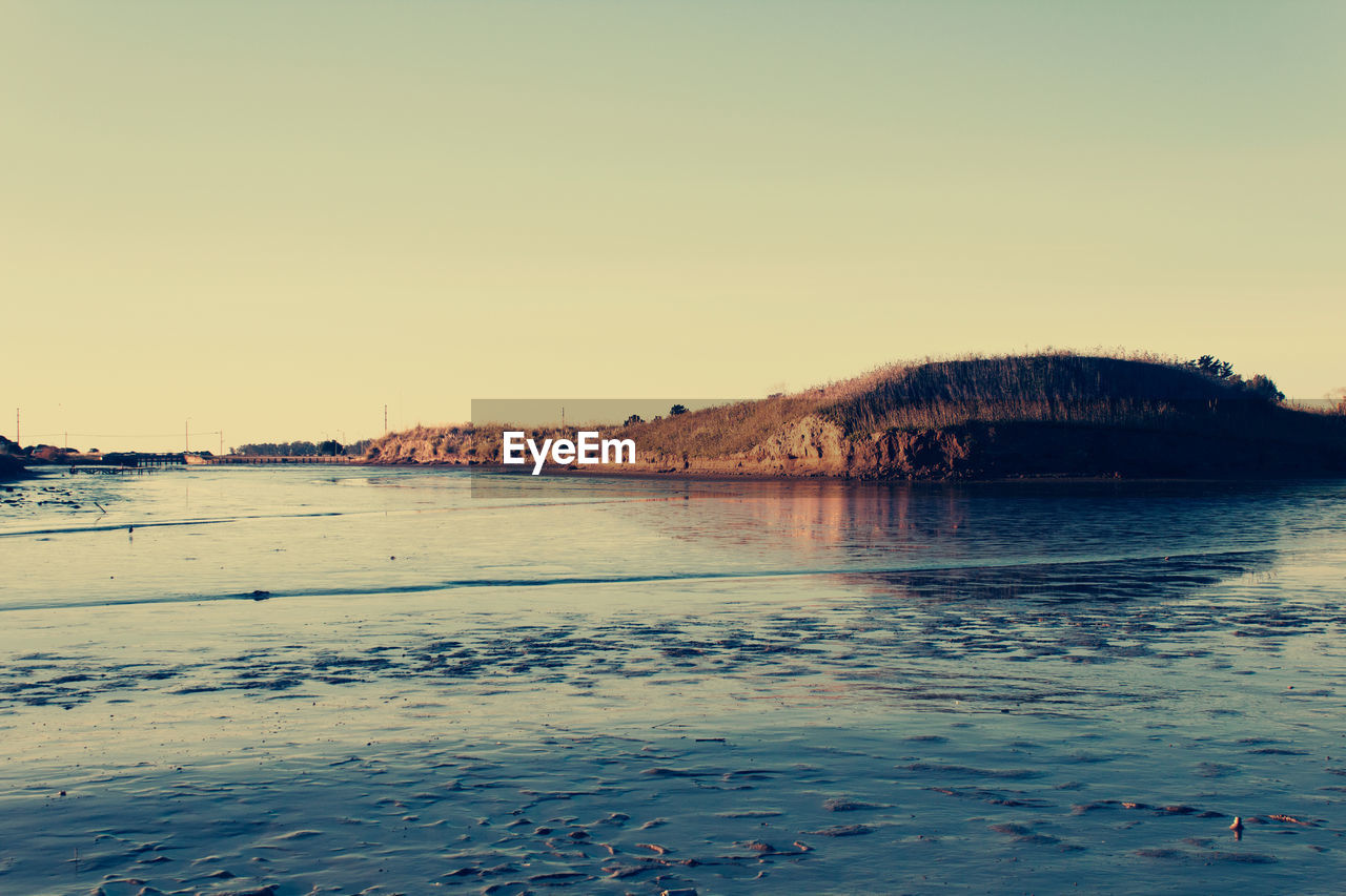 Scenic view of sea against clear sky