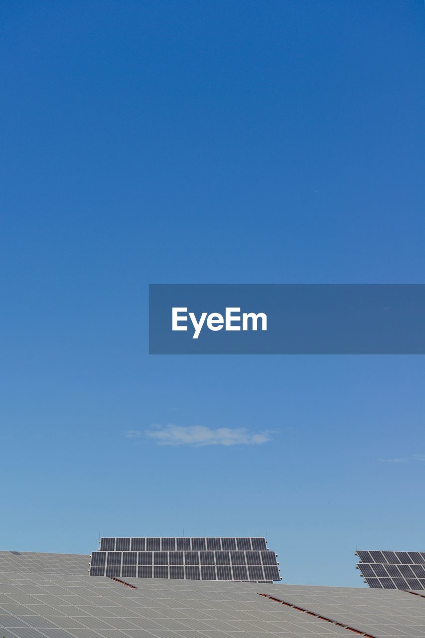 Solar panels against blue sky