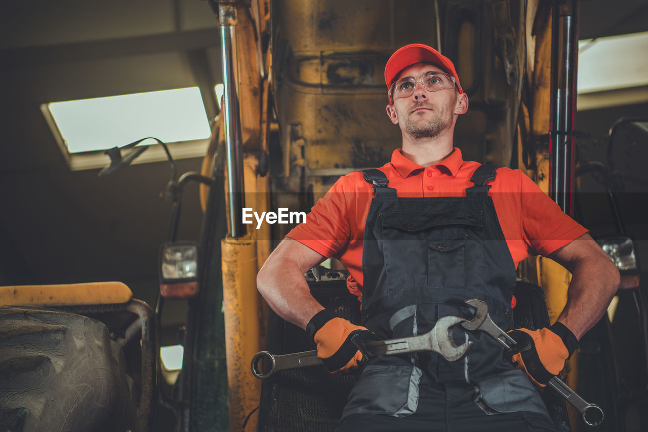 side view of man working at construction site