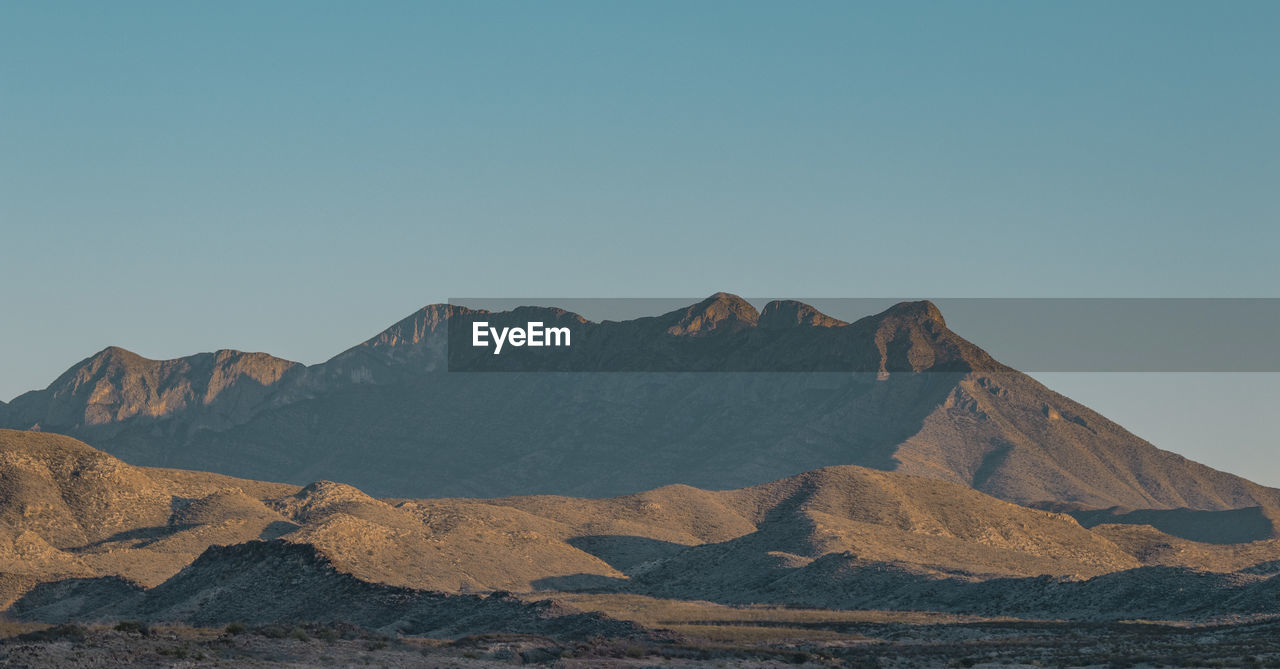 Scenic view of desert against clear sky