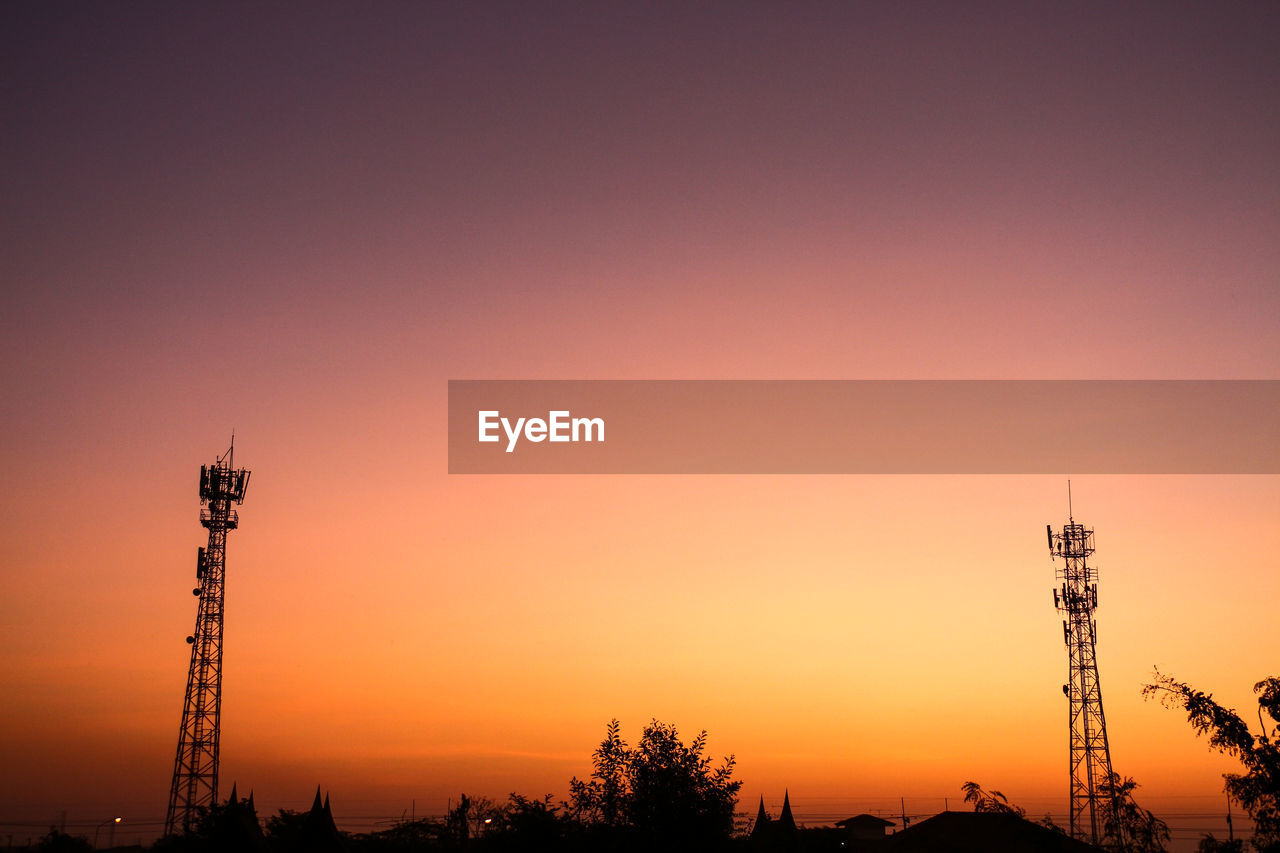 Silhouette of tower against sky during sunset