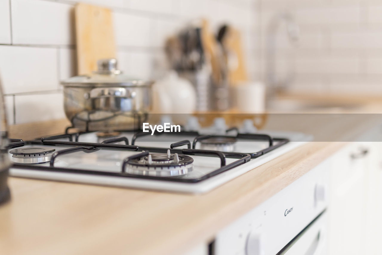 Close up of gas stove bright kitchen in scandinavian style