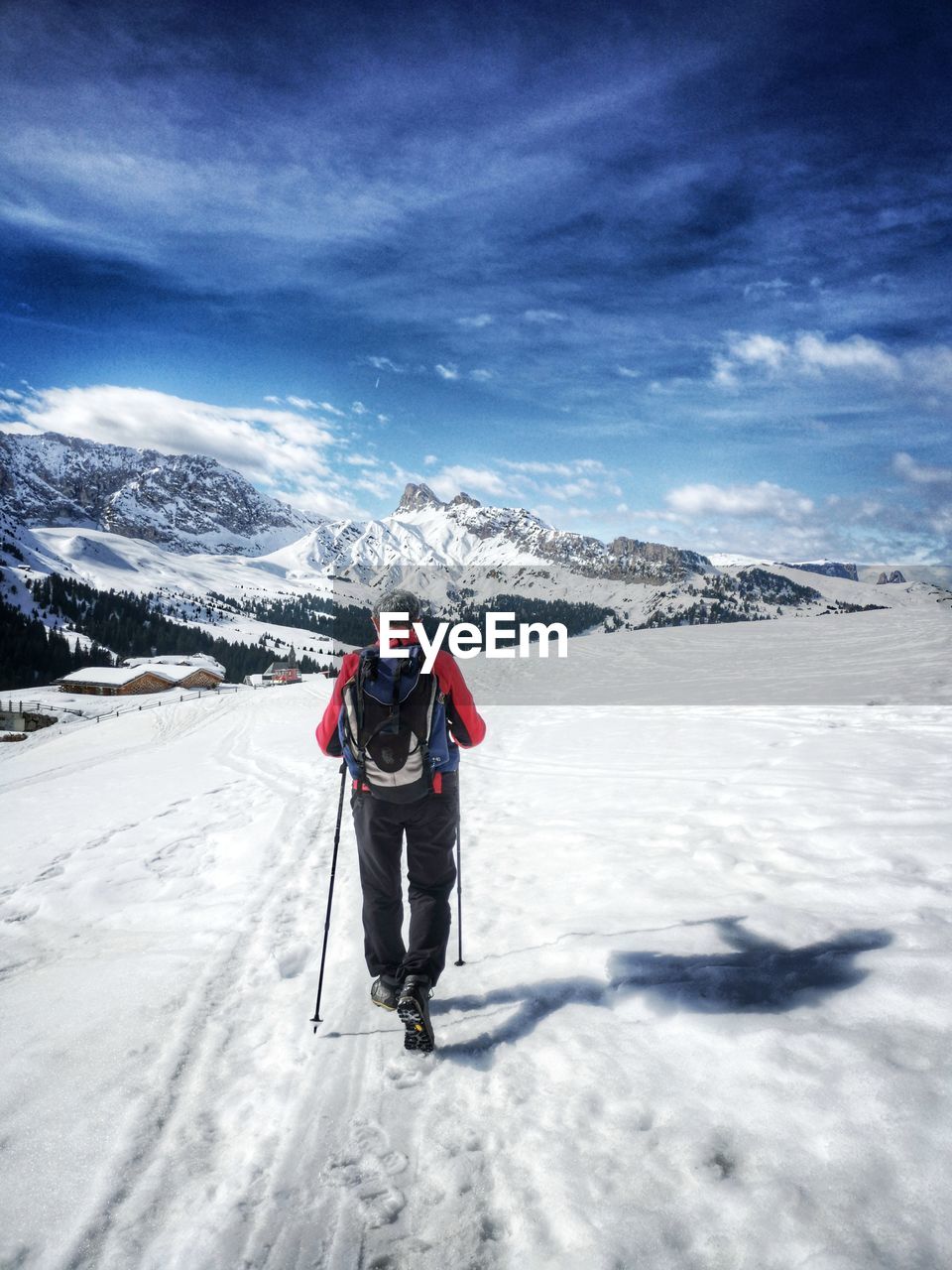 Full length of person on snowcapped mountain against sky