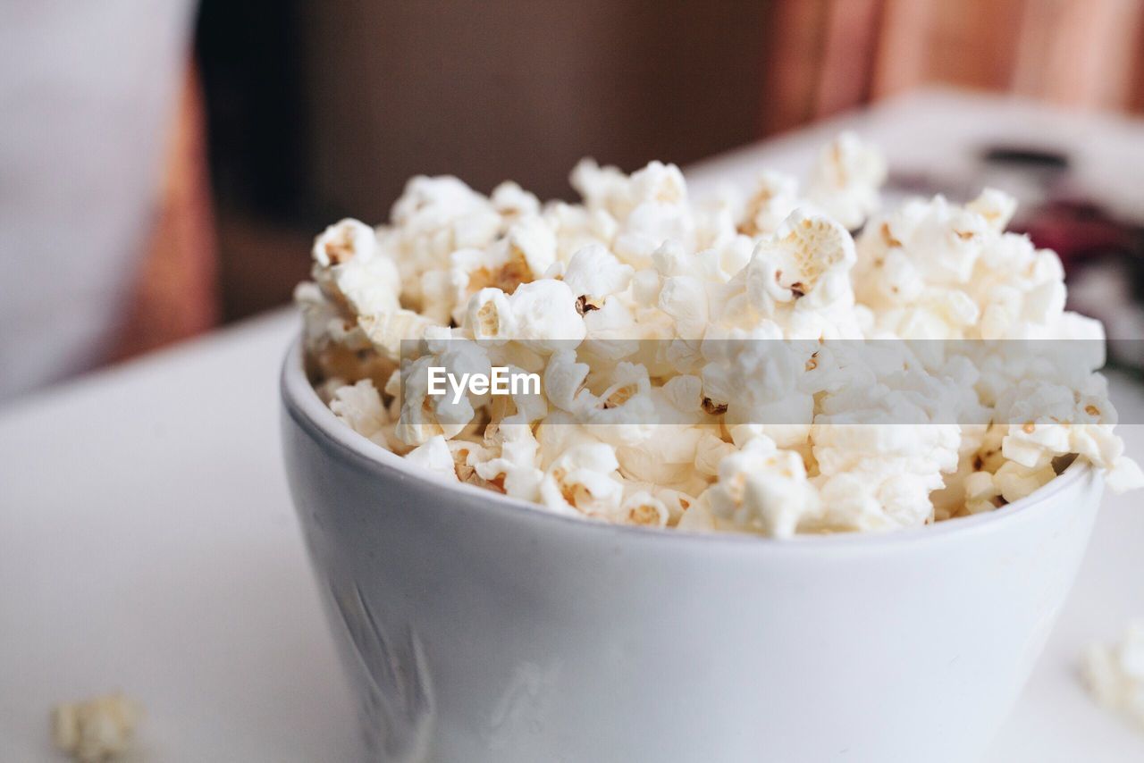 Close-up of popcorns in bowl on table