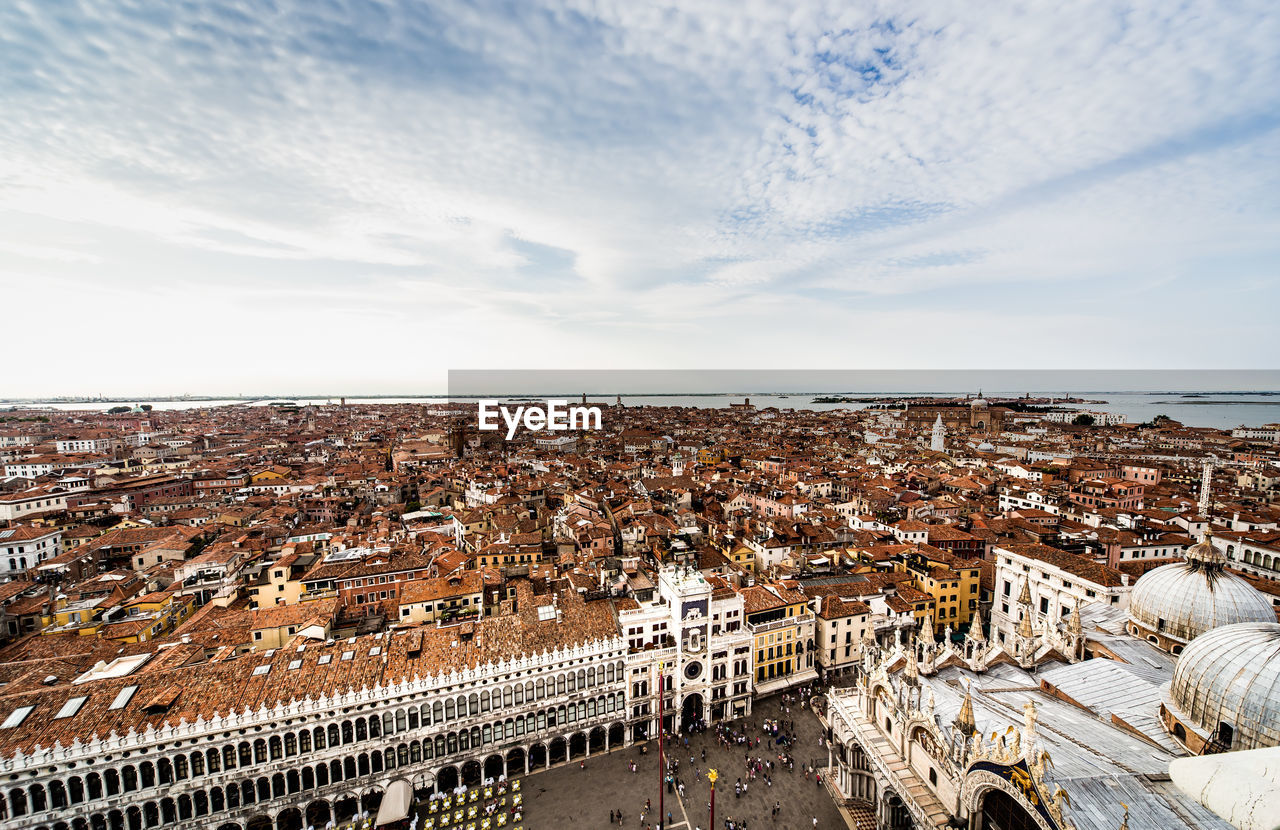 Saint marks basilica by townscape against sky