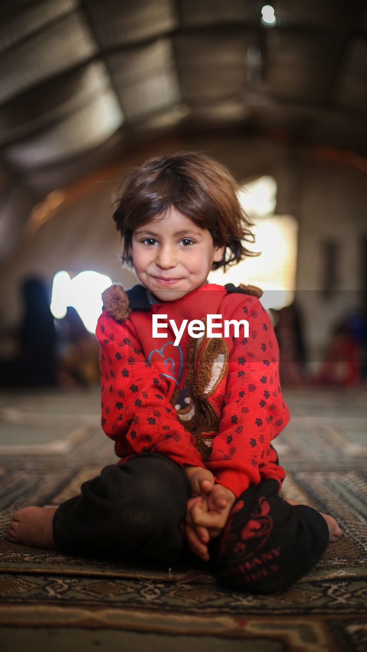 A cute little girl in a syrian refugee camp. 