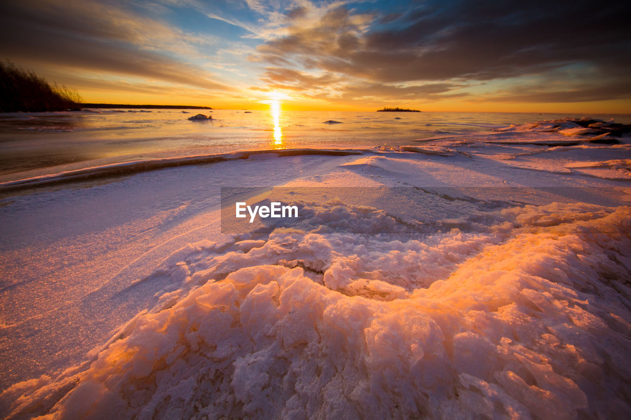 Frozen baltic sea during sunset