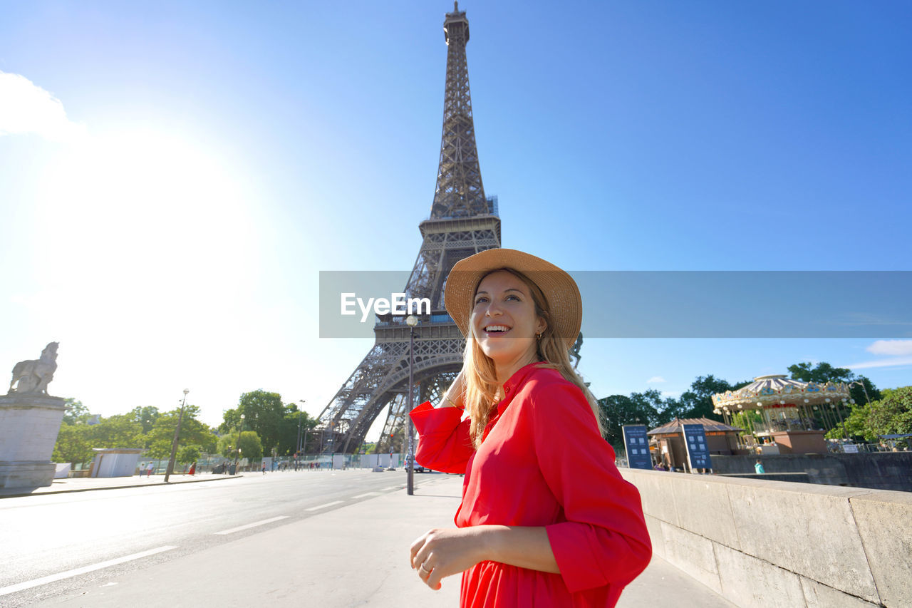 Let's explore europe. excited traveler girl visiting paris, france. wide angle.