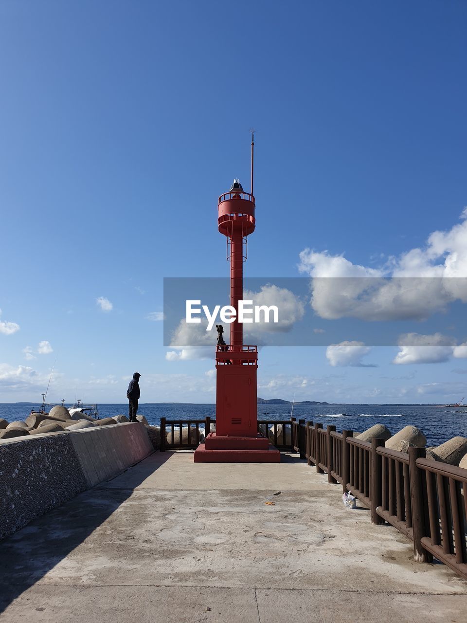 LIGHTHOUSE AGAINST SKY