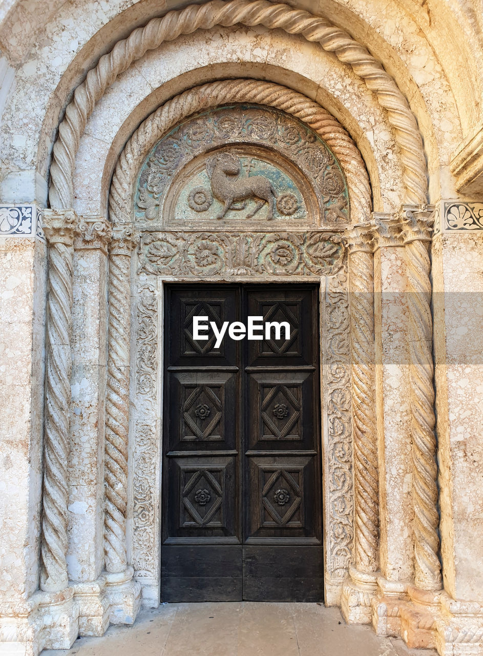 Ornate door entrance of cathedral st. anastasia in zadar, croatia