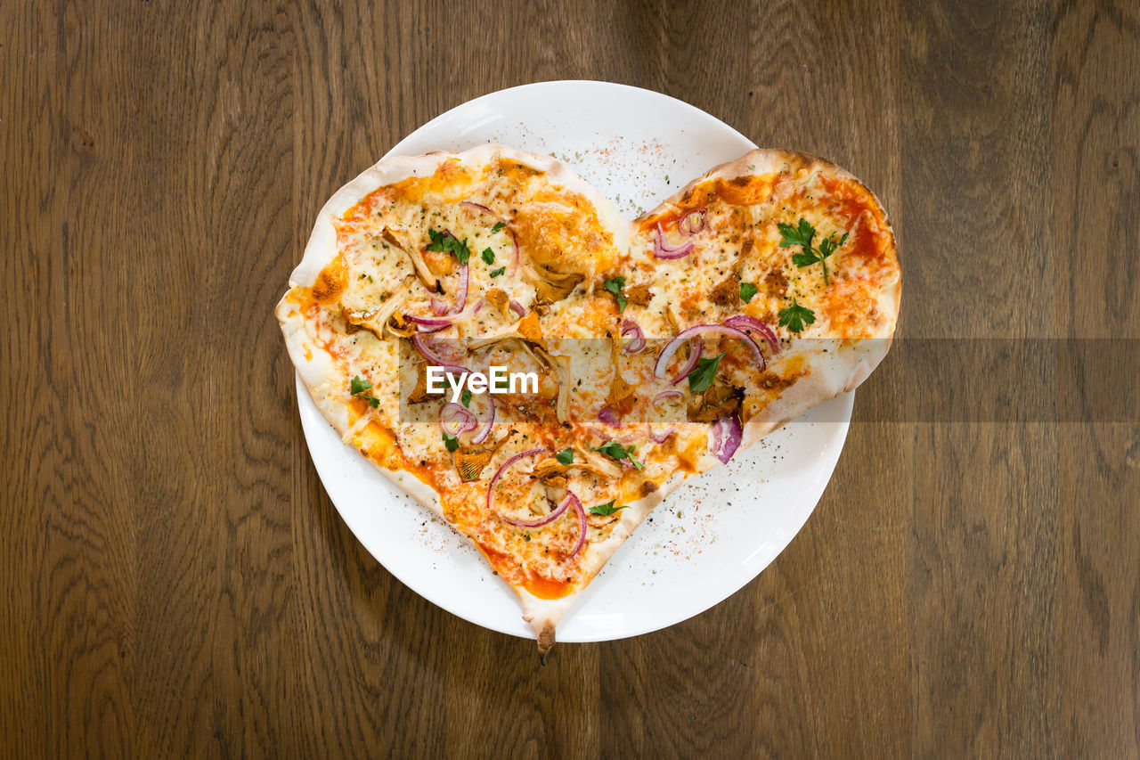 Close-up of heart shape pizza on table