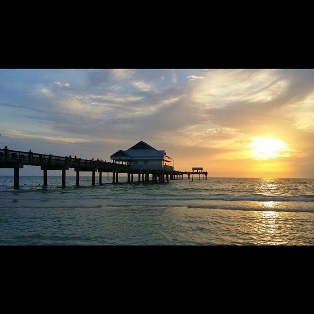 SCENIC VIEW OF SUNSET OVER SEA