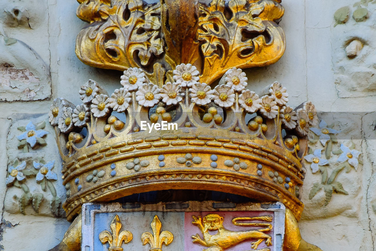 Close up view of the crown decoration above st johns cambridge college gates