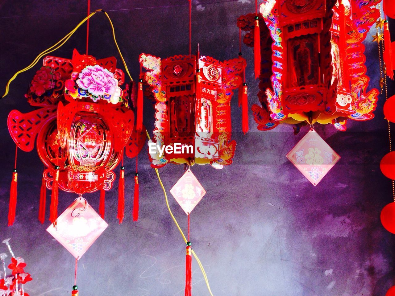 Chinese lanterns hanging against wall